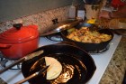 Tortillas in the oil, onions and potatoes almost finished.