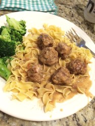 Swedish Meatballs swimming in perfect gravy, served with broccoli.