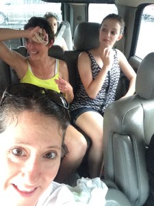 Very VERY wet hikers make it to the car...